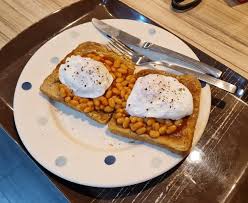 2 poached eggs on 2 toast with Beans
